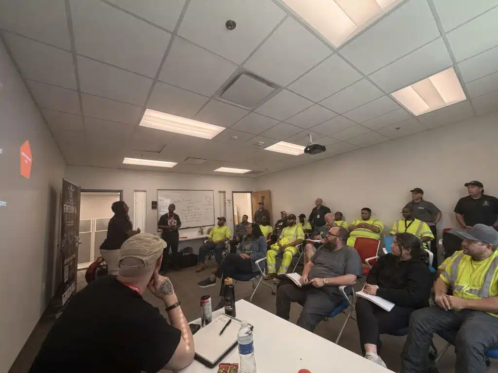 Trouble Defense instructors leading a workplace safety training session for an employee group