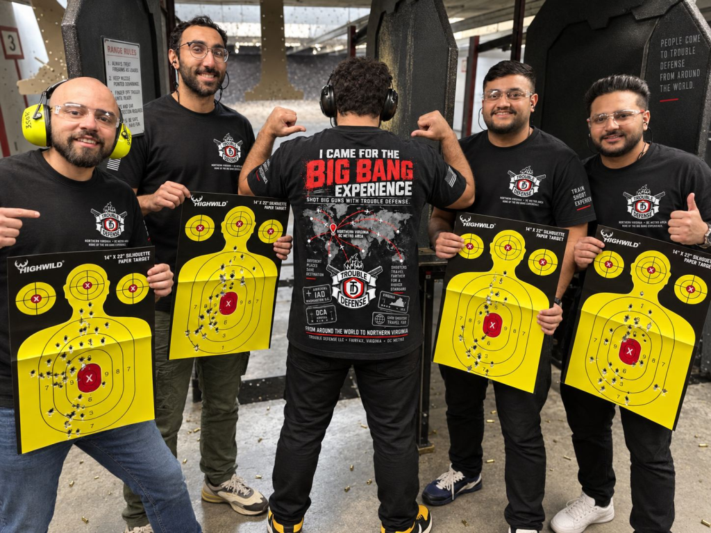 BIG BANG Shooting Experience guests with Trouble Defense shirts and souvenir targets